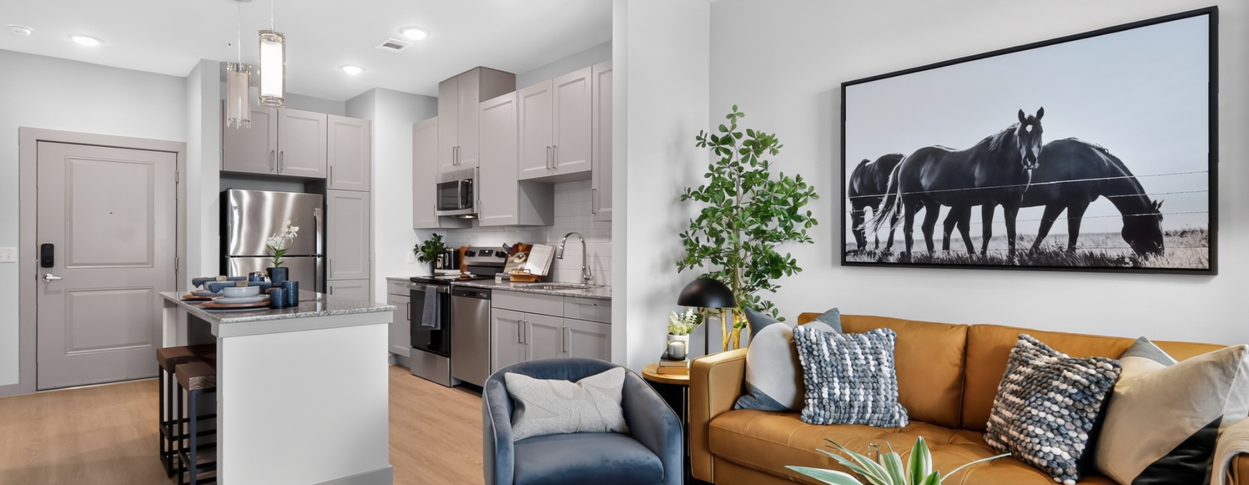 a kitchen and living room with furniture