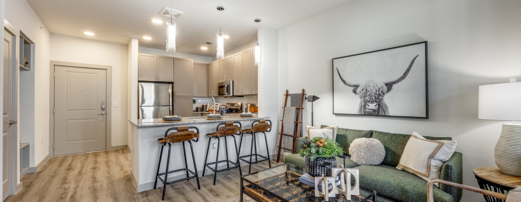 a kitchen and living room with furniture