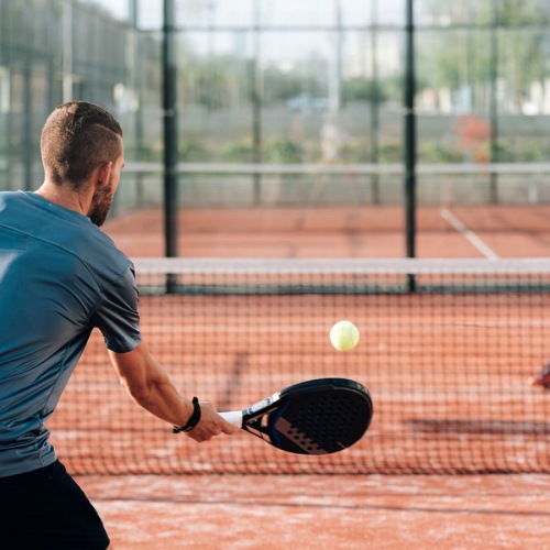 two men playing pickleball