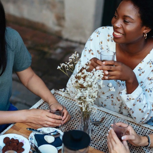 three women sitting at a table